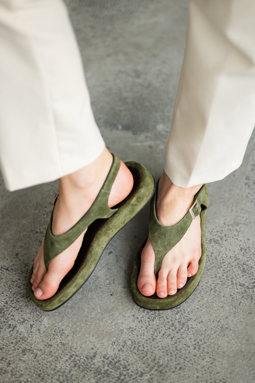 Green suede toe loop sandals with ankle strap and buckle closure