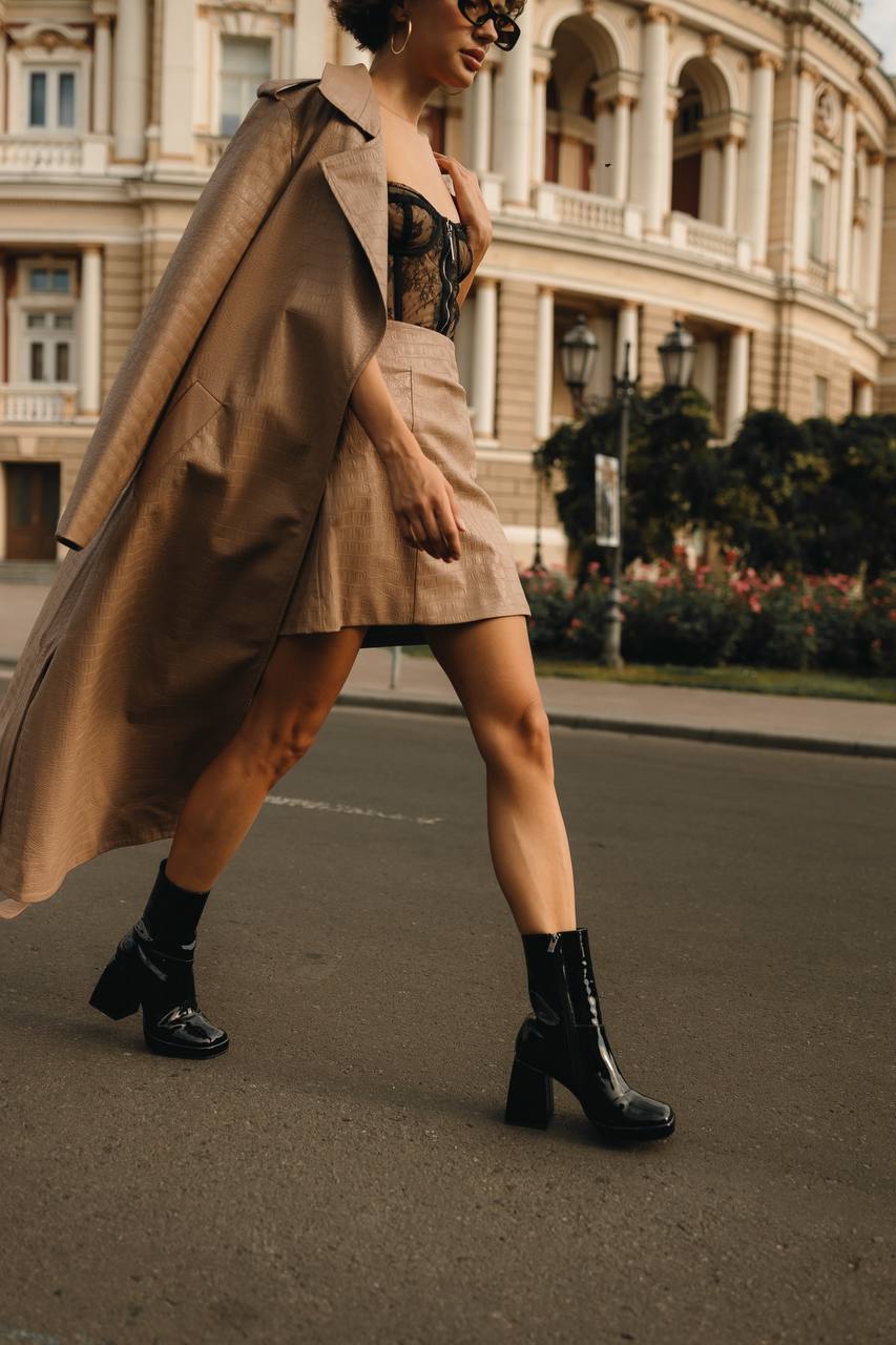 Square toe patent leather boots side view
