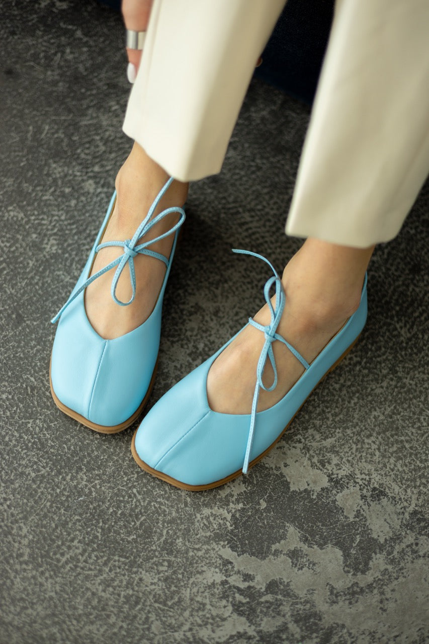 Wide toe leather ballet flats with straps front view