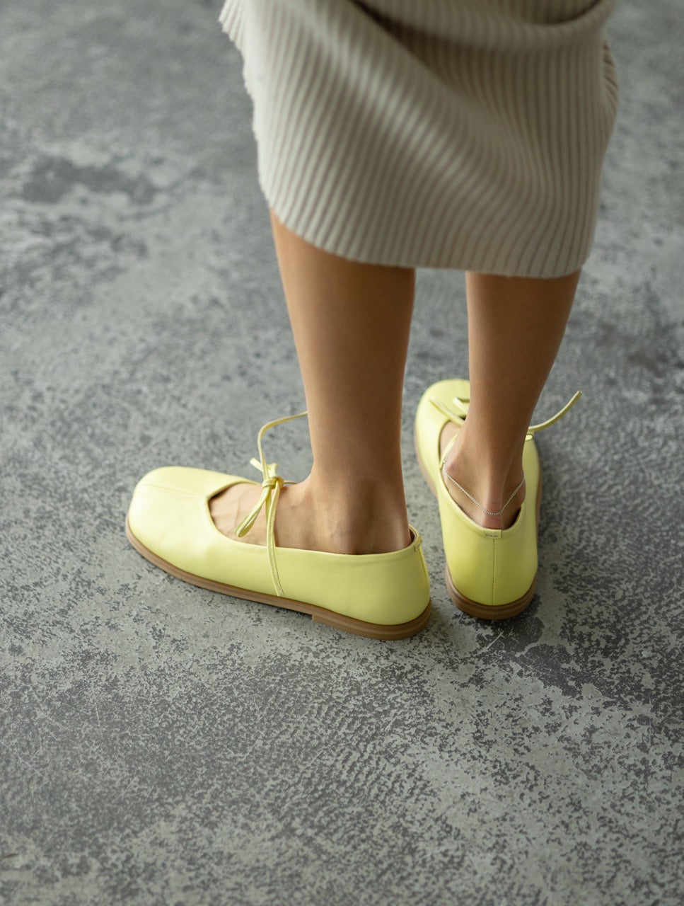 Yellow flats on feet