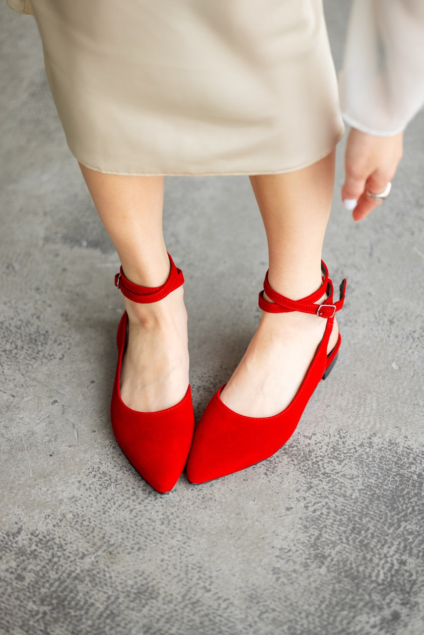 Red suede slingback ballet flats with pointed toe and ankle straps
