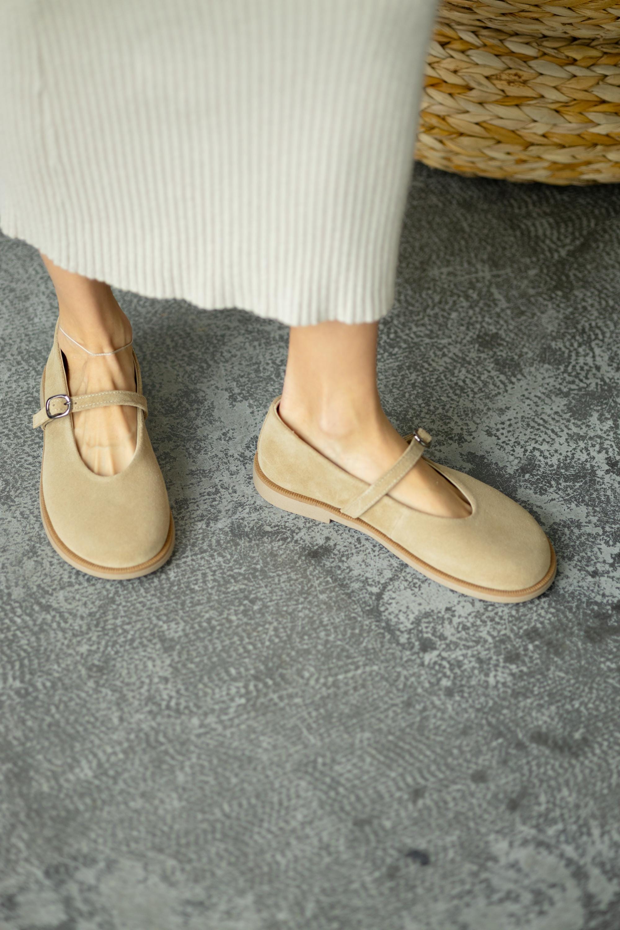 Flexible sole suede flats bottom view