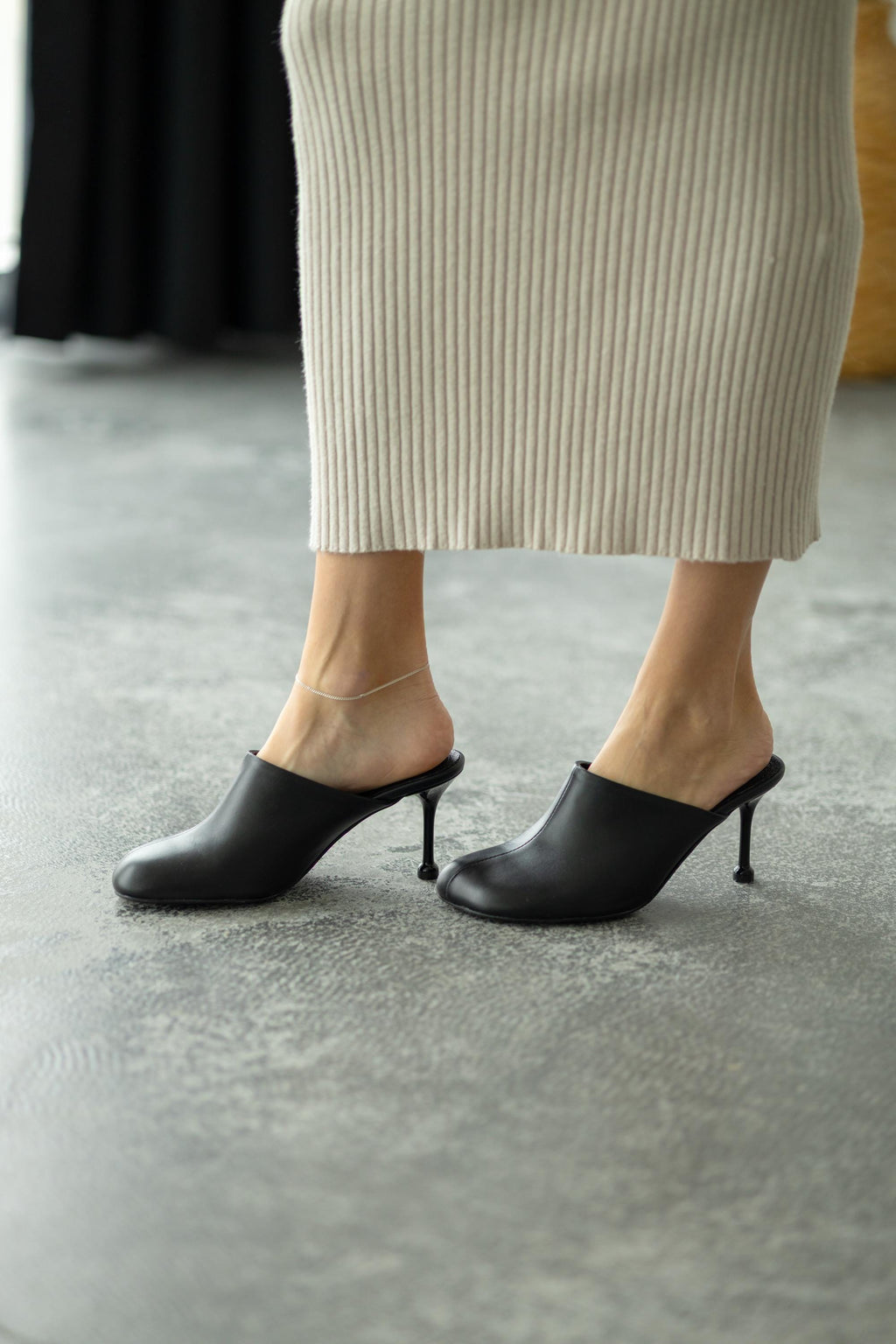 1. Black leather slingback heels front view
