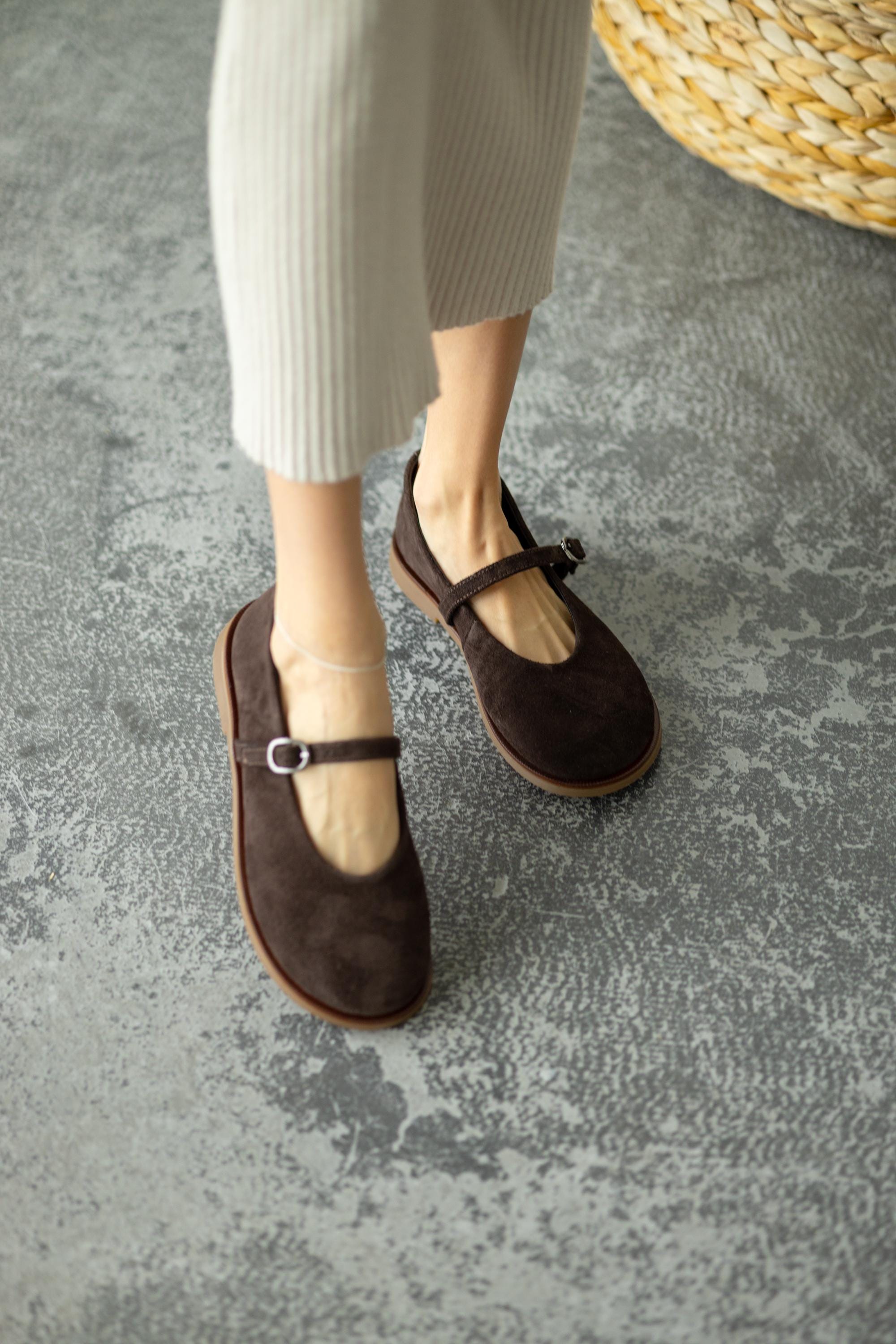 Brown suede flats close-up texture
