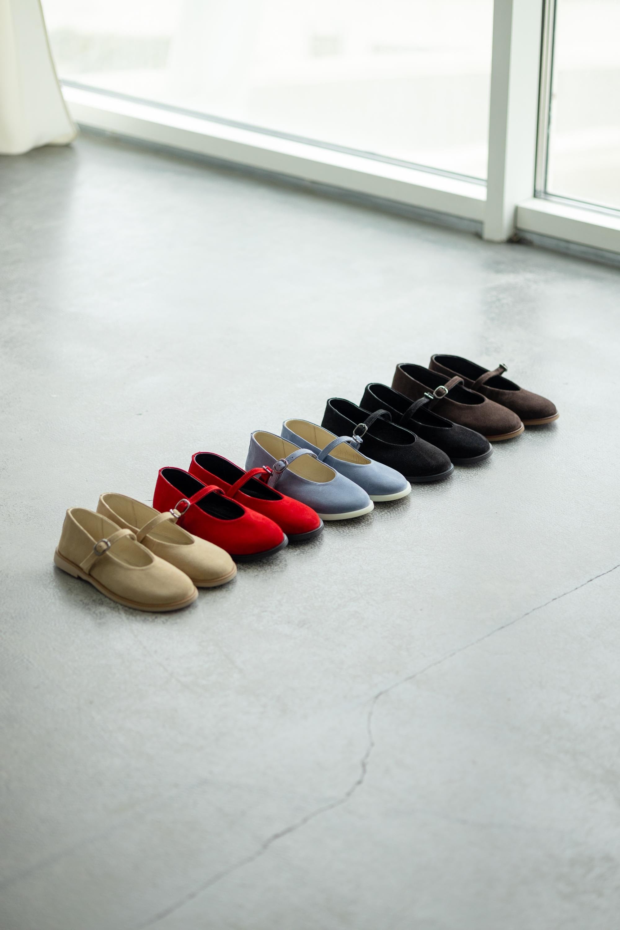 Wide toe suede flats side view