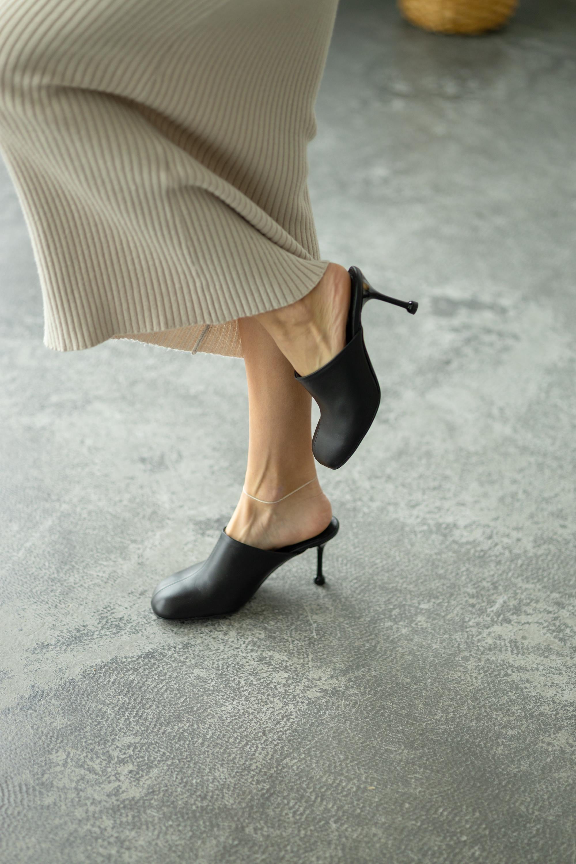 Heel and sole detail of leather slingback shoes