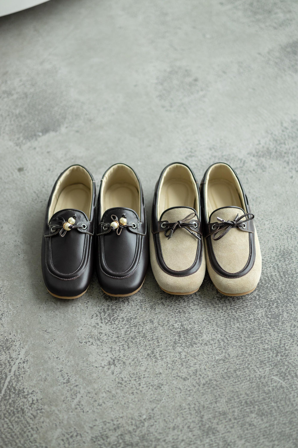 Decorative lacing detail on beige suede slip-on loafers