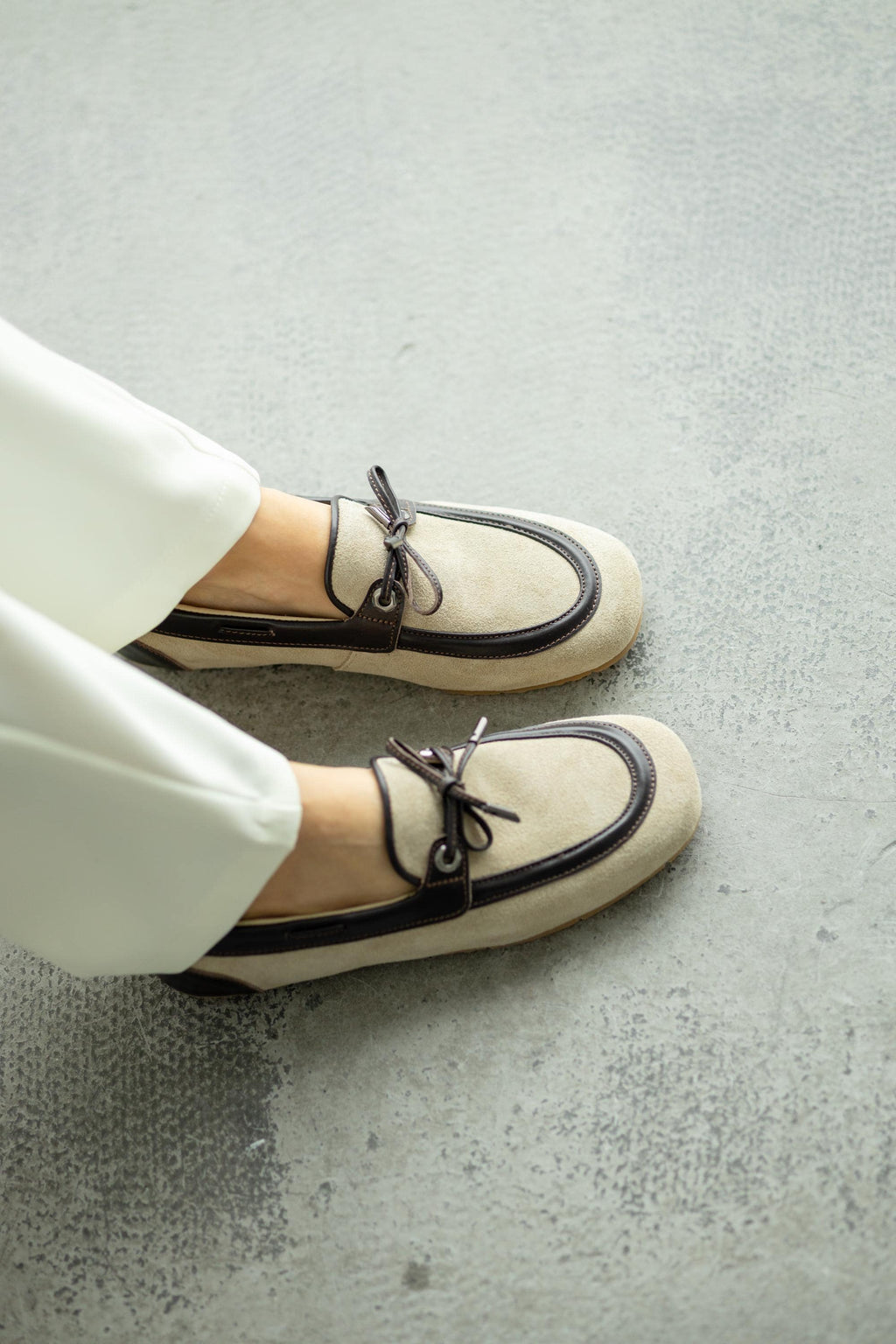 Lightweight flexible sole beige suede mules close-up
